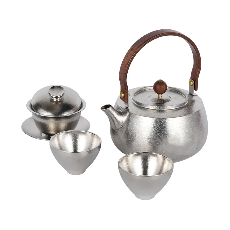 Juego de té de titanio con tazas y cuenco con mango de madera